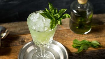 boozy refreshing absinthe frappe cocktail with ice and mint