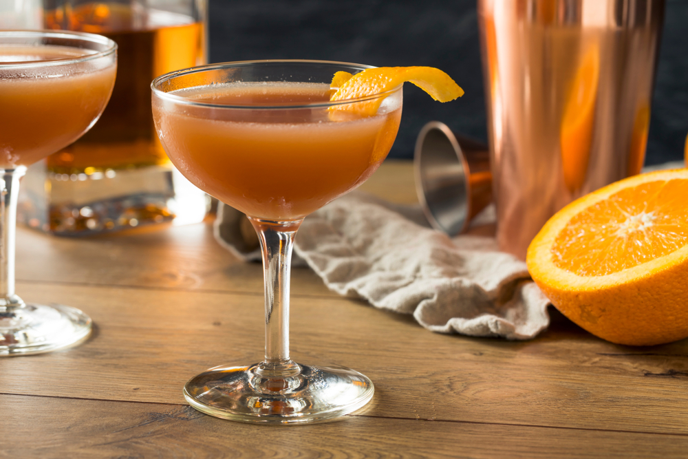 Homemade Smokey Blood and Sand Cocktail with Orange Juice and Scotch